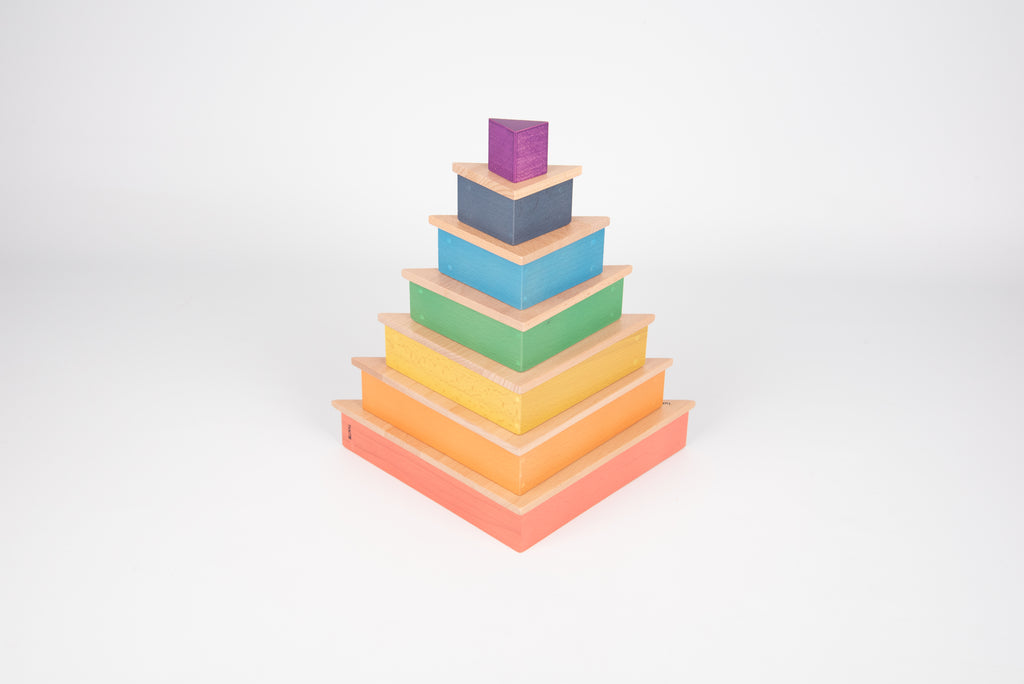 Rainbow triangle stacking blocks, multicolor wooden pieces stacked like a pyramid.