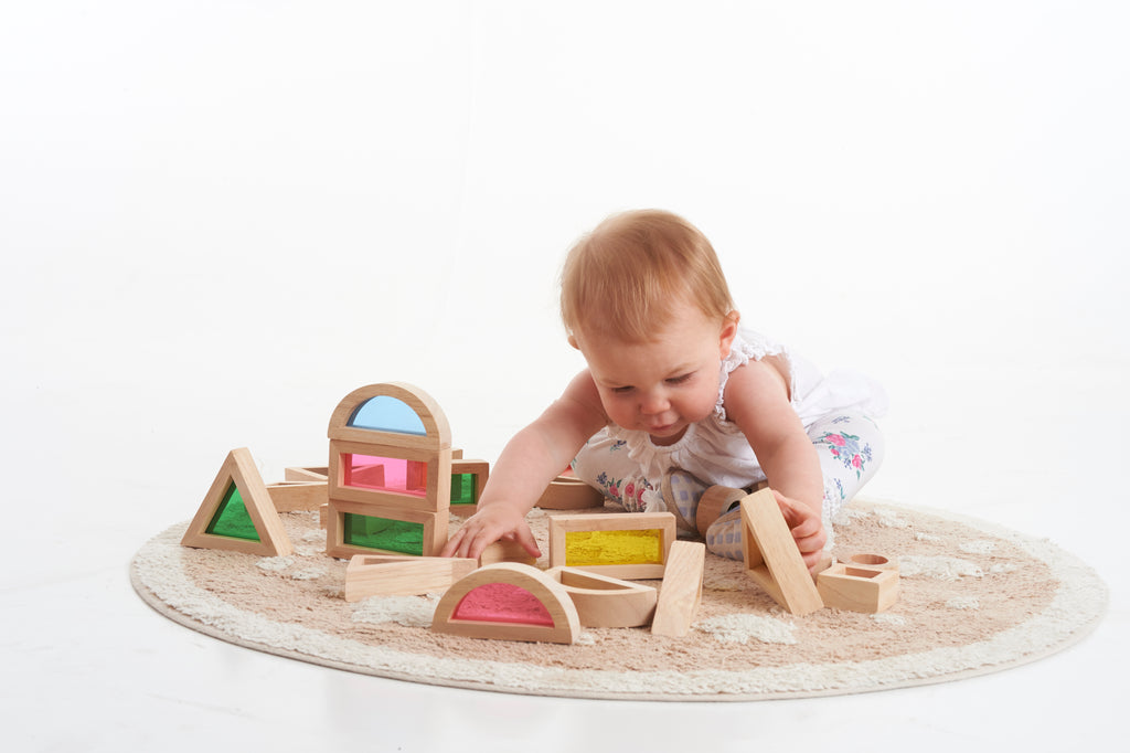 Wooden rainbow block set with arched, triangular, and cube shape blocks