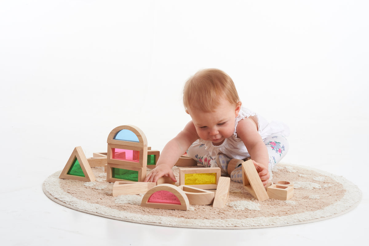Wooden rainbow block set with arched, triangular, and cube shape blocks