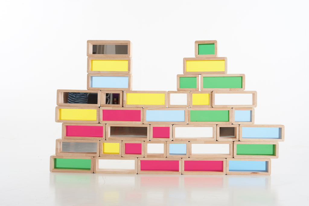 Rainbow windowed wooden blocks arranged in a multi-level wall shape