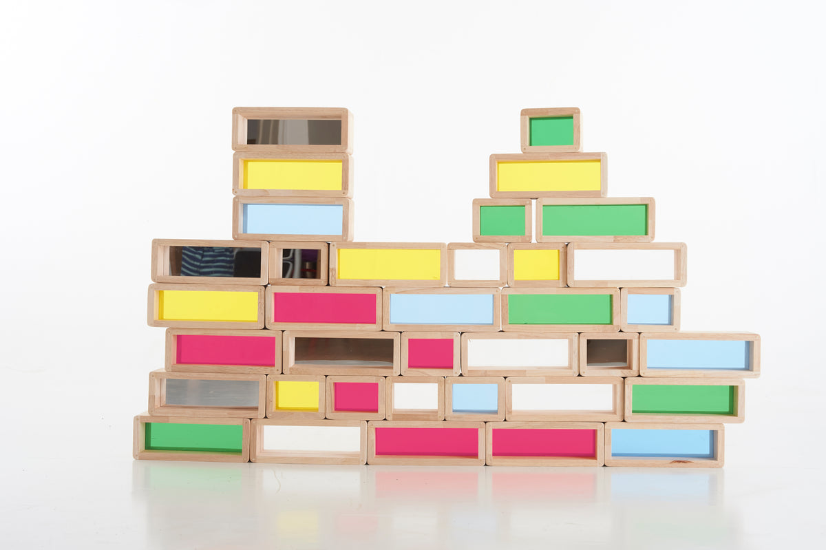 Rainbow windowed wooden blocks arranged in a multi-level wall shape