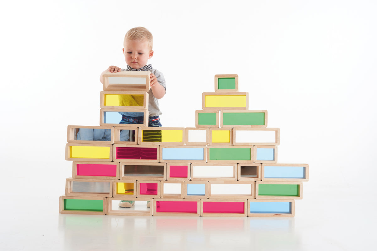 Wooden rainbow window block toy stacked into a wide stepped structure