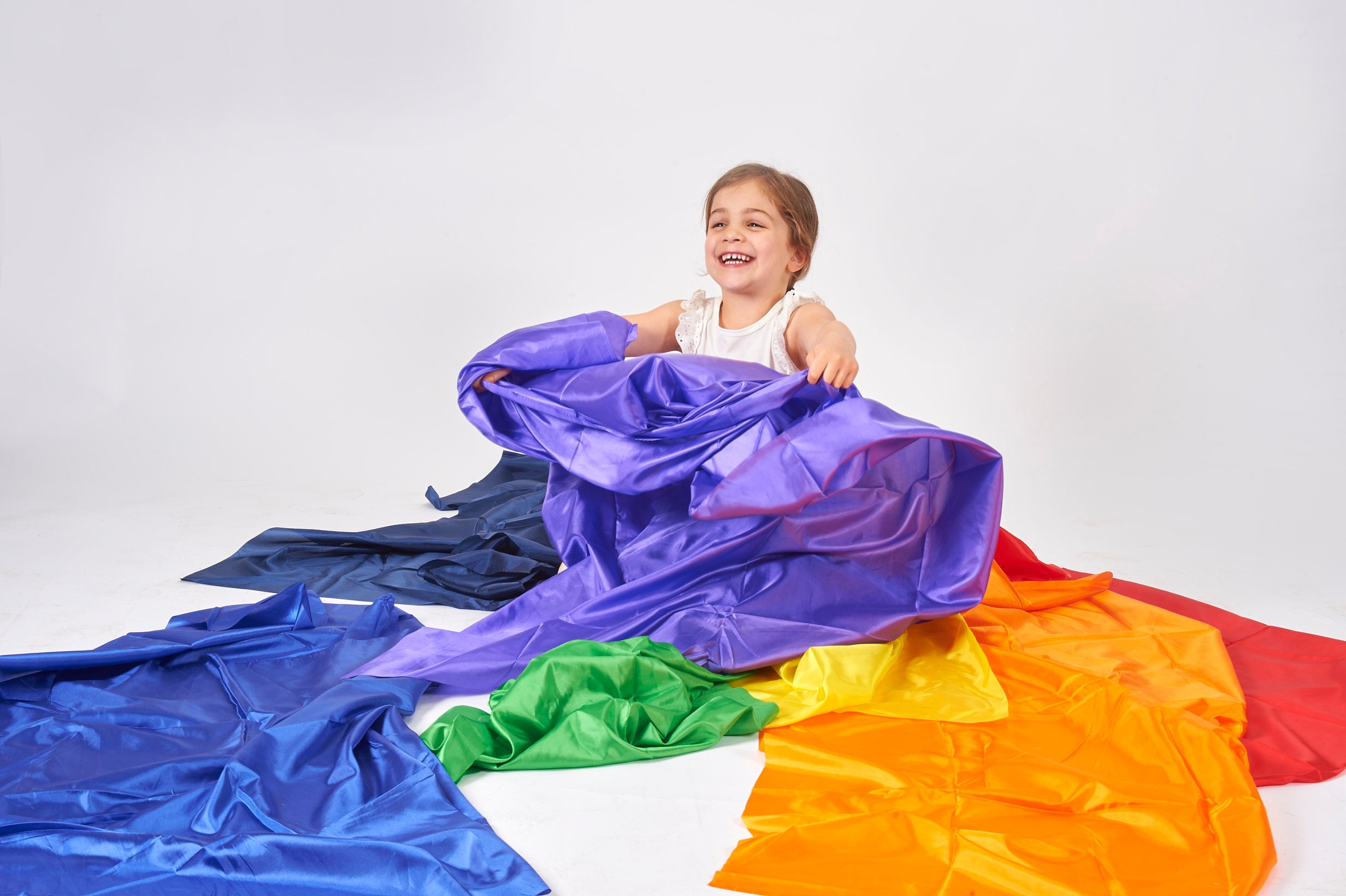 Blue habutae fabric with folded green and orange sections, crinkled finish
