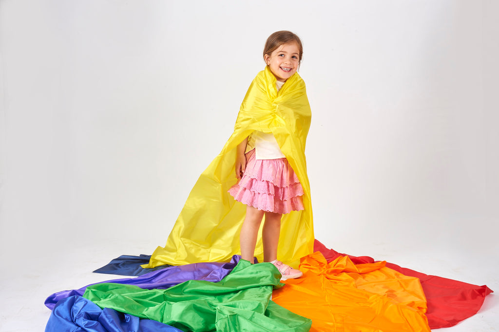 Yellow habutae fabric draped over folded green and orange sections
