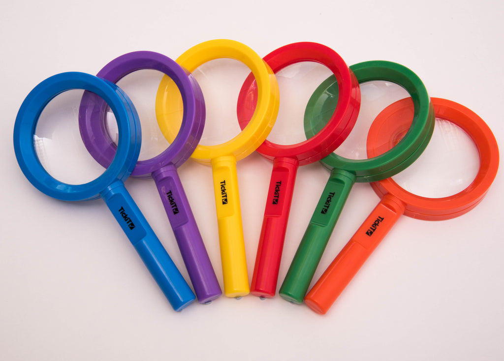 Assorted color handheld magnifying glasses with round lenses, multiple handles shown