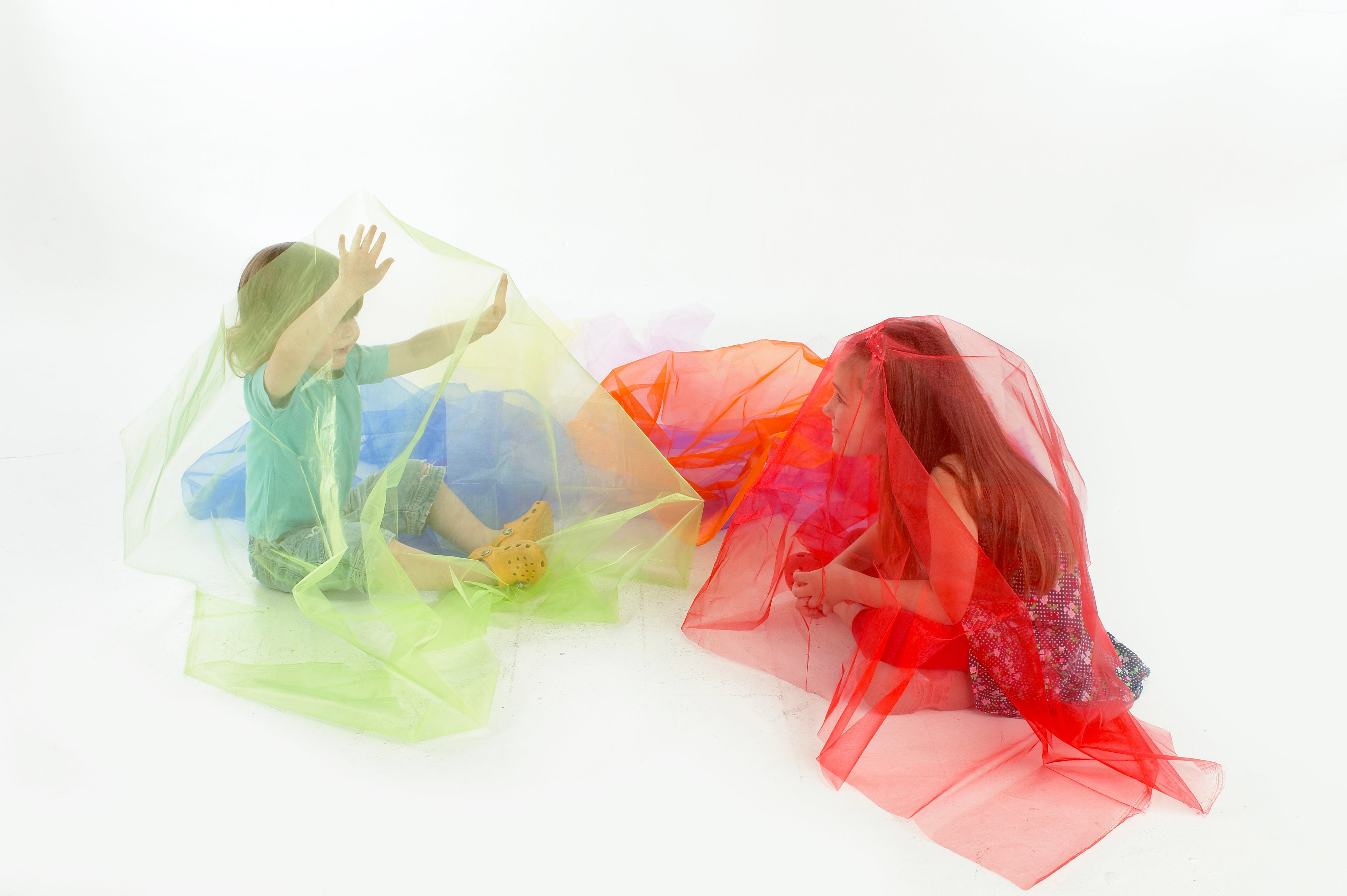 Rainbow organza fabric pieces, sheer layered swirls in green, yellow, orange and red
