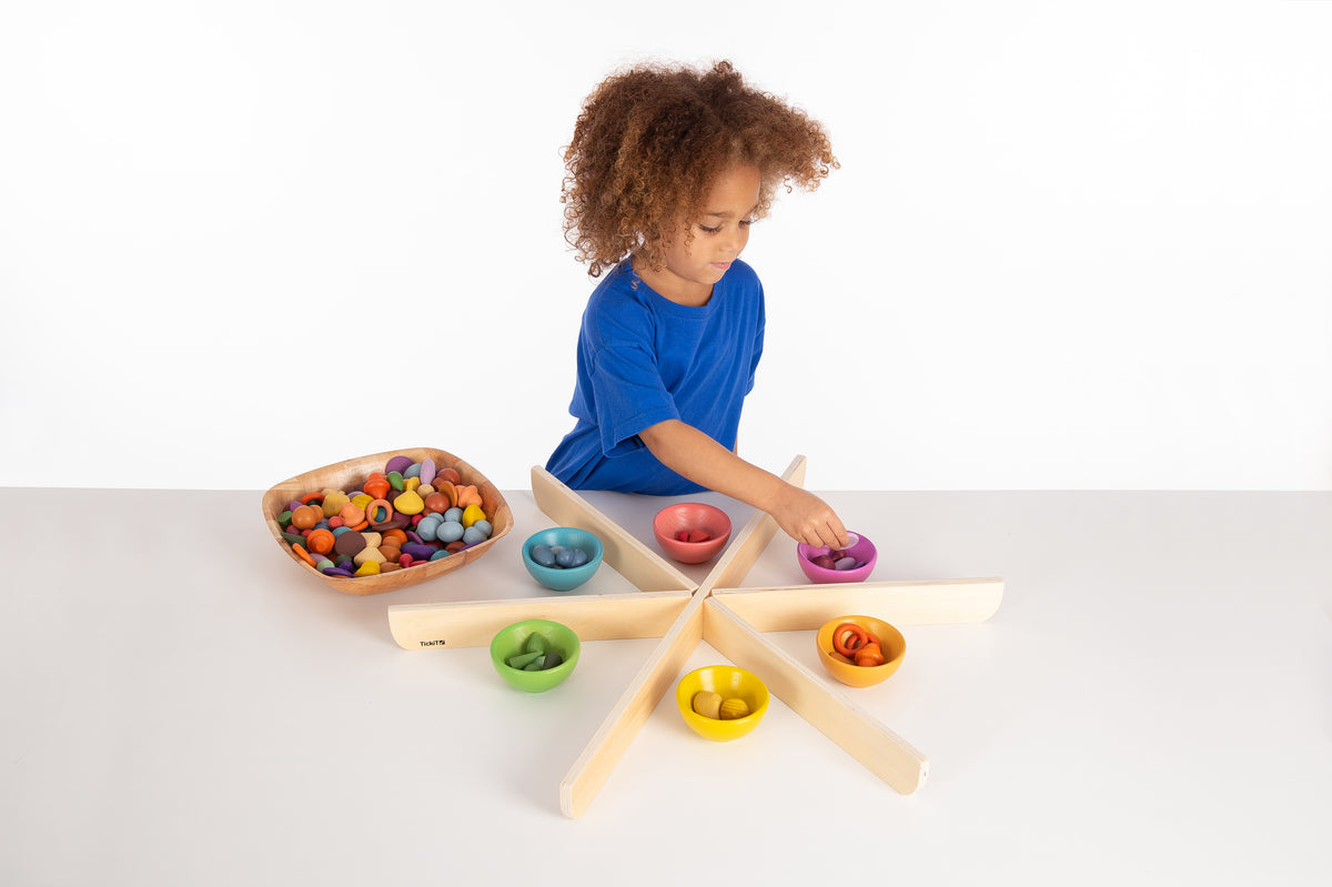 Rainbow child bowls and star-shaped stand with small pieces
