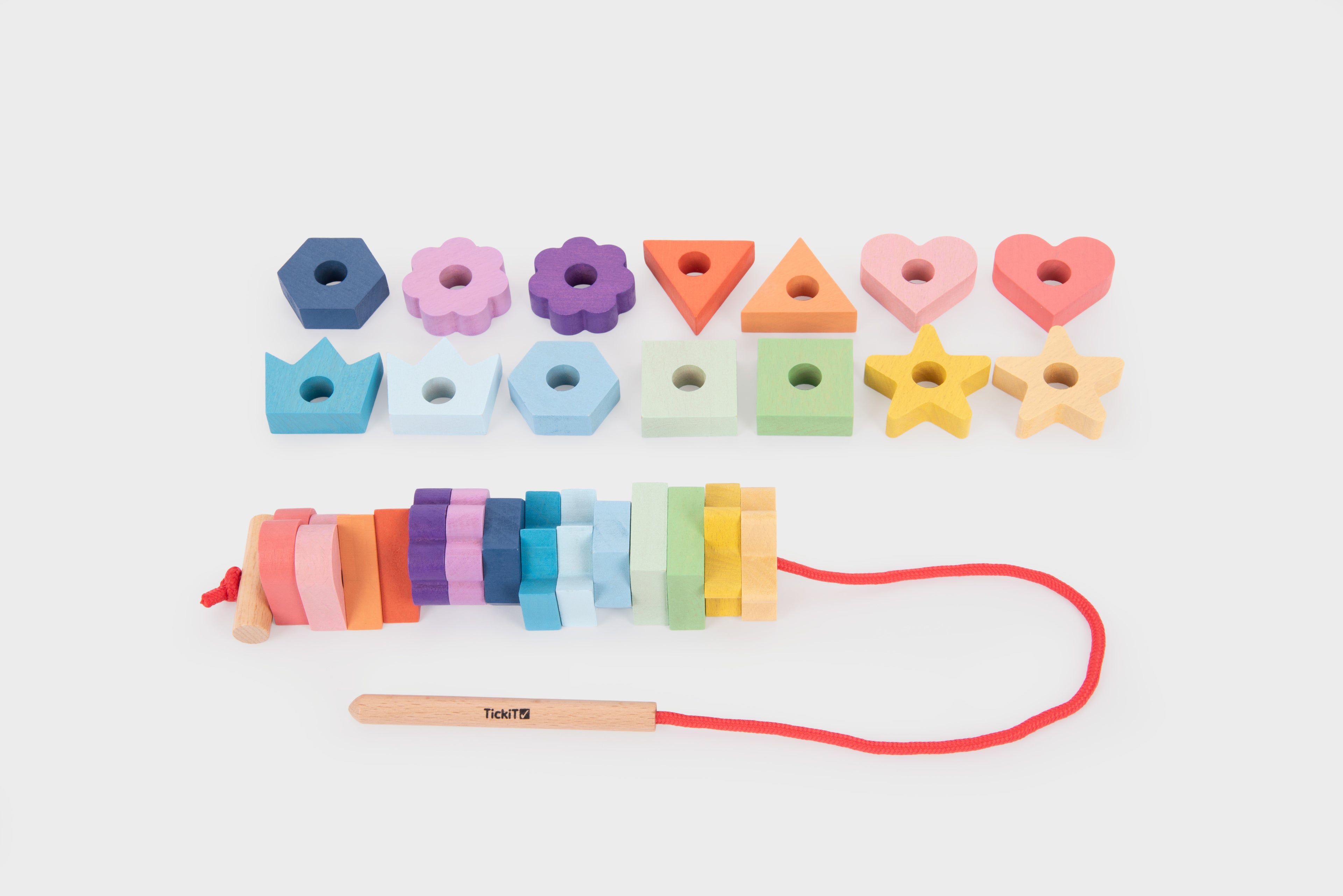 Rainbow wooden lacing shapes with heart, star, flower, and triangle pieces
