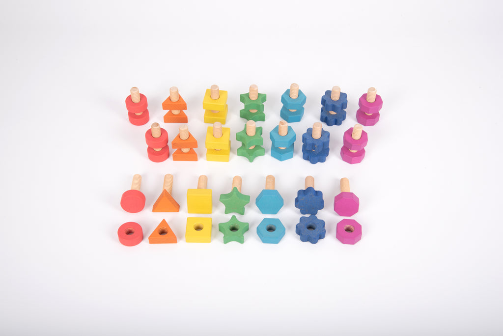Rainbow wooden nut-and-bolt set pieces laid out: round, star, hex, and cross shapes