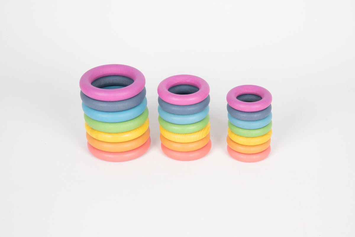 Three stacks of small rainbow rings with colored interlocking loops