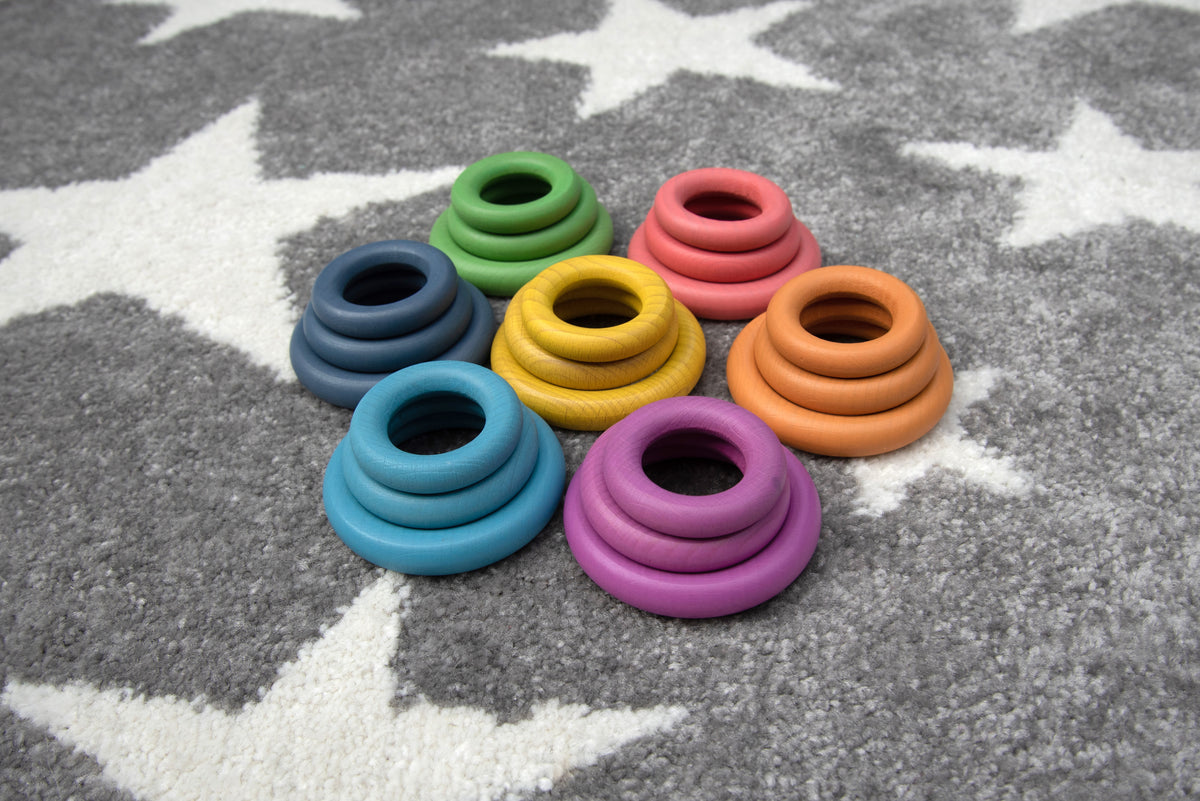 Assorted rainbow ring loops in blue, green, yellow, purple, and orange