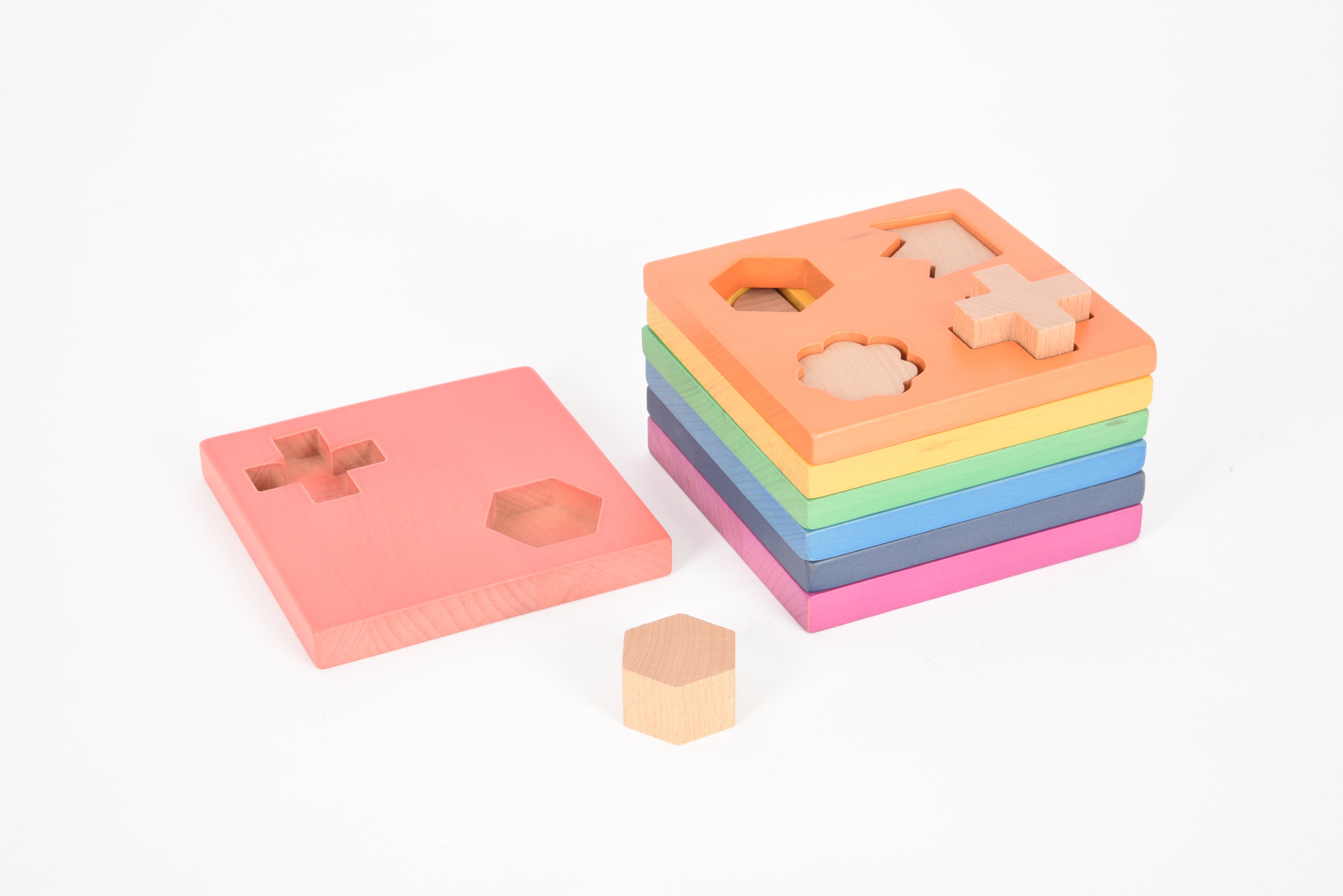 Rainbow wooden shape stacker with cutout pieces and rainbow color base boards