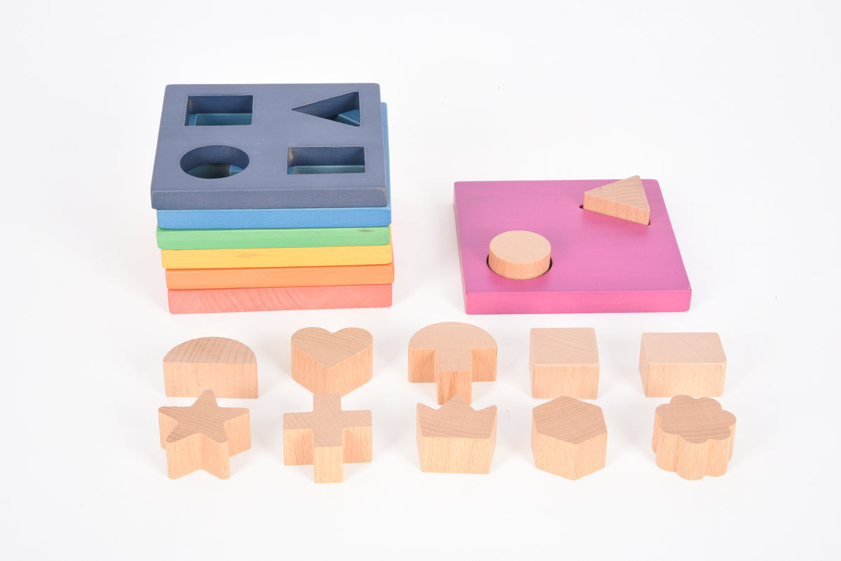 Rainbow wooden shape stacker with person and animal-like figure cutout pieces