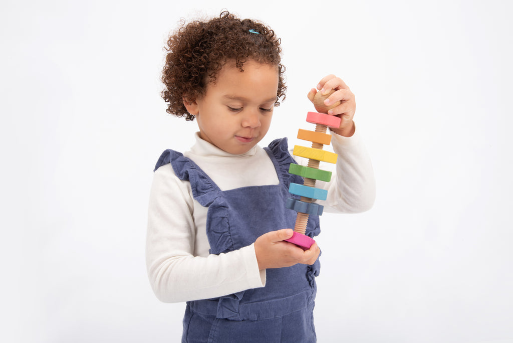 Rainbow wooden shape twister with multicolor ringed pieces and wooden blocks