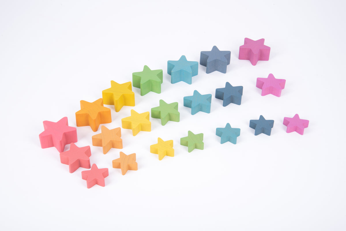 Multicolor wooden star blocks scattered in a loose cluster