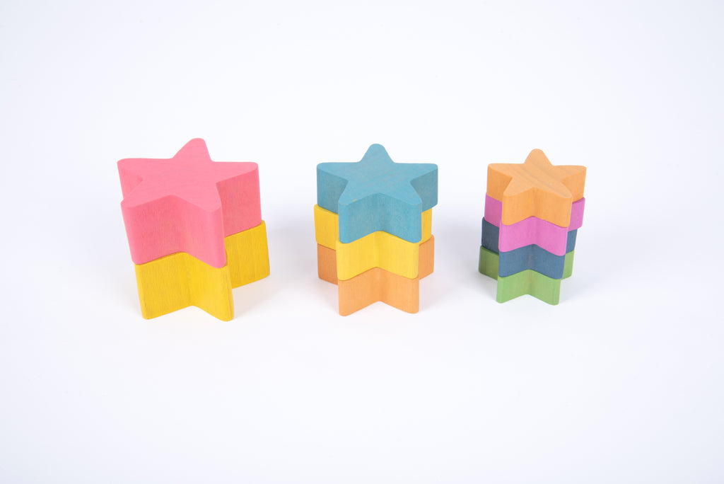 Three wooden star stacking blocks with layered rainbow coloring