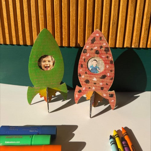 Rocket ship photo frames, green and red with circular child picture window