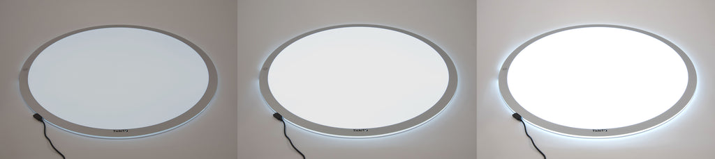 Round LED light panel with bright white circular glow and silver outer ring