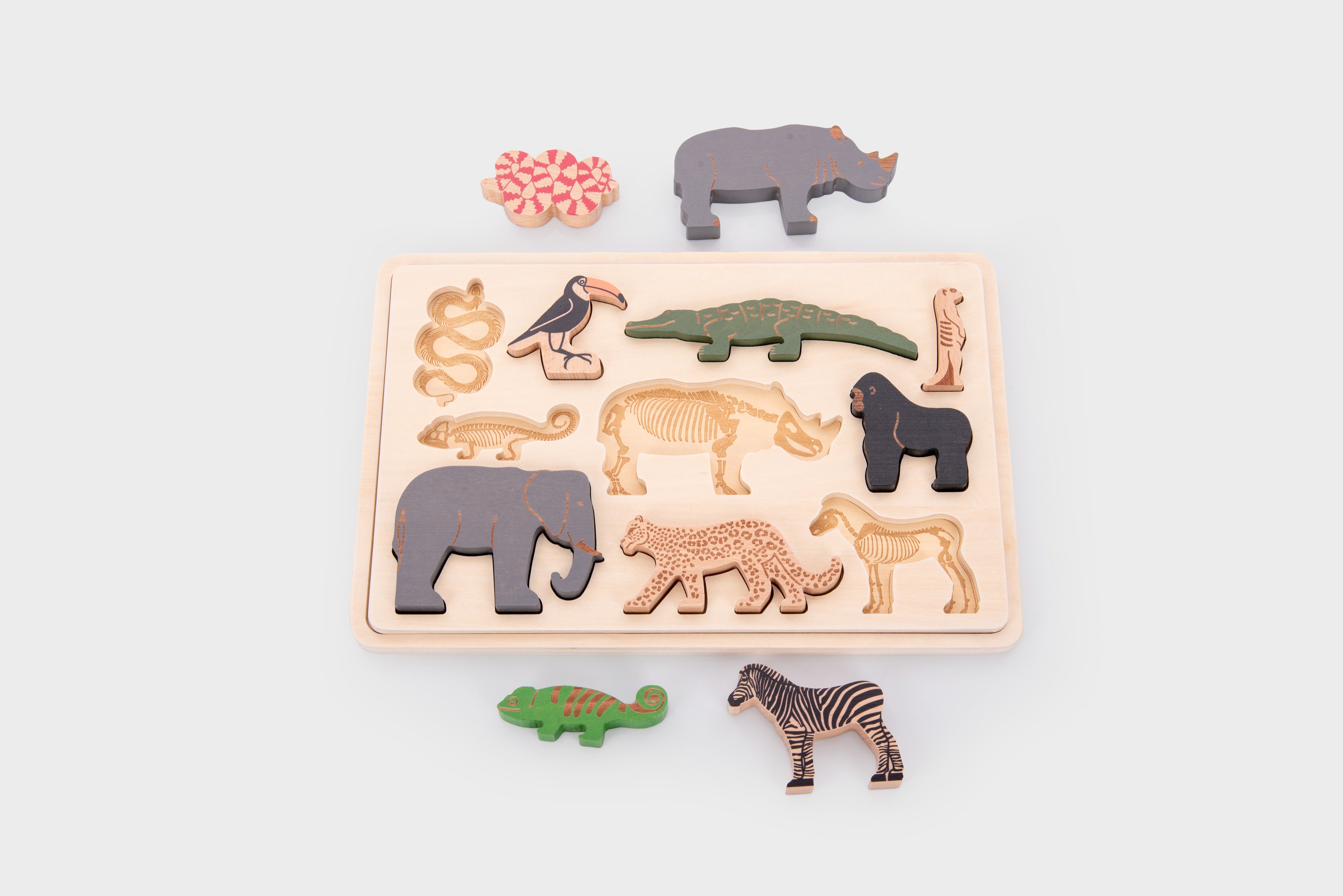 Safari animal puzzle board with colorful animal-shaped pieces and detached parts
