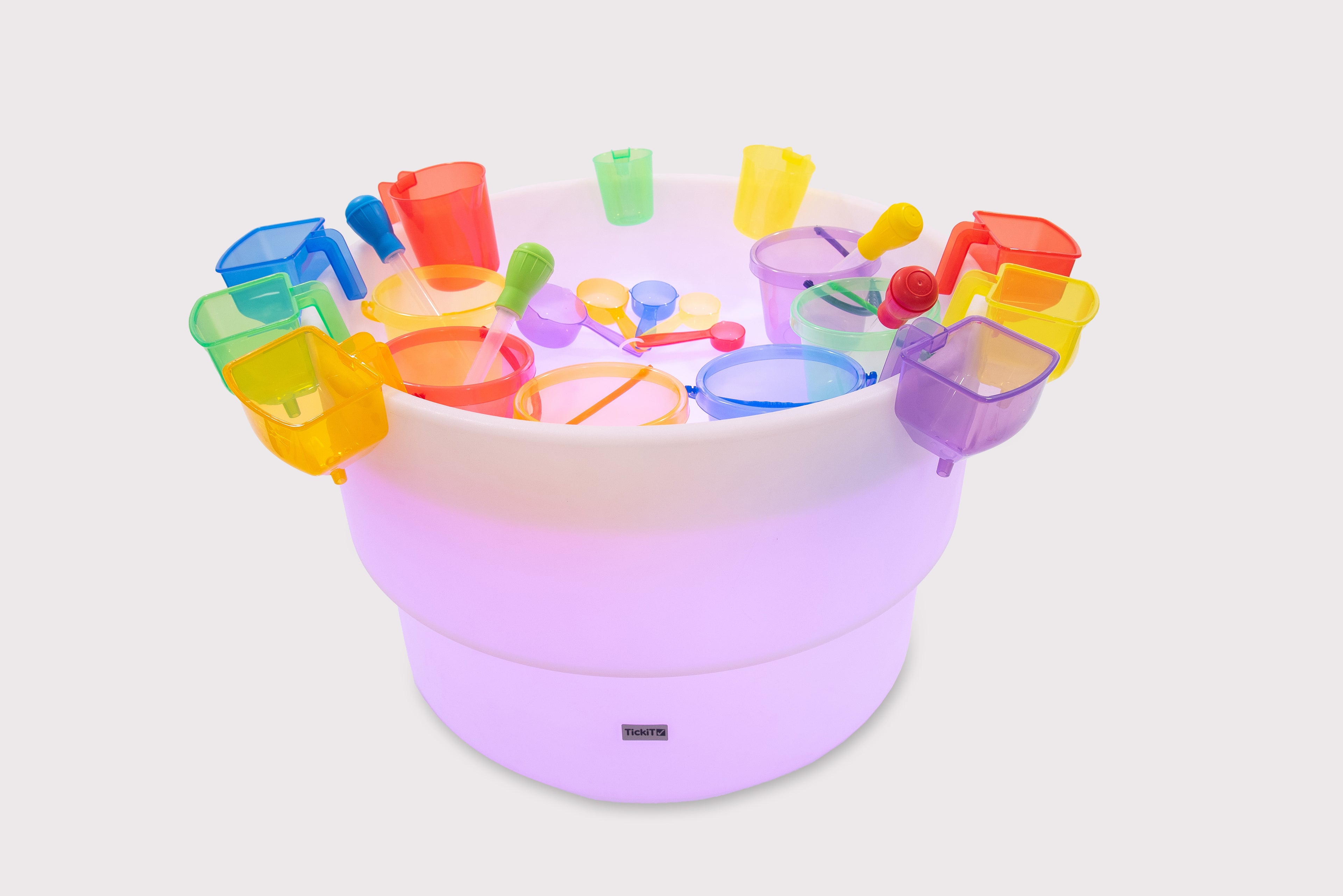 Light round water and sand table with rainbow plastic cups, buckets, and scoops