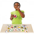 Scent match-up kit with circular scent cards and matching pieces, shown on table