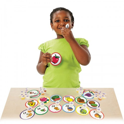 Scent match-up kit with circular scent cards and matching pieces, shown on table