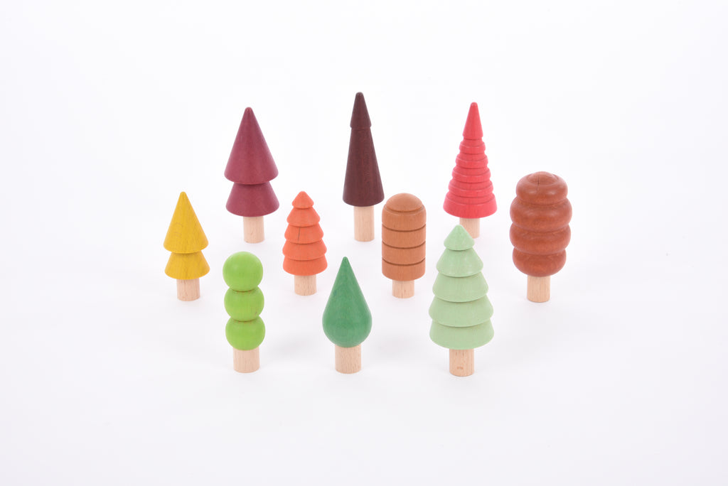 Assorted multicolor wooden tree figures, varied shapes and colors
