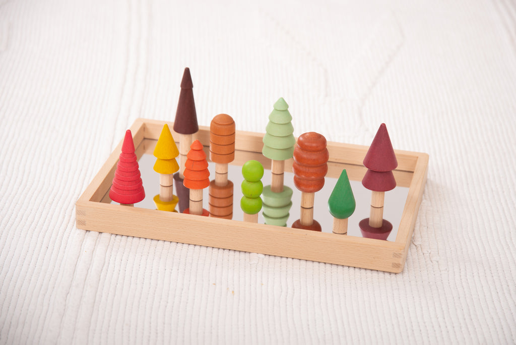 Rectangular wooden tray with multicolor wooden tree figures