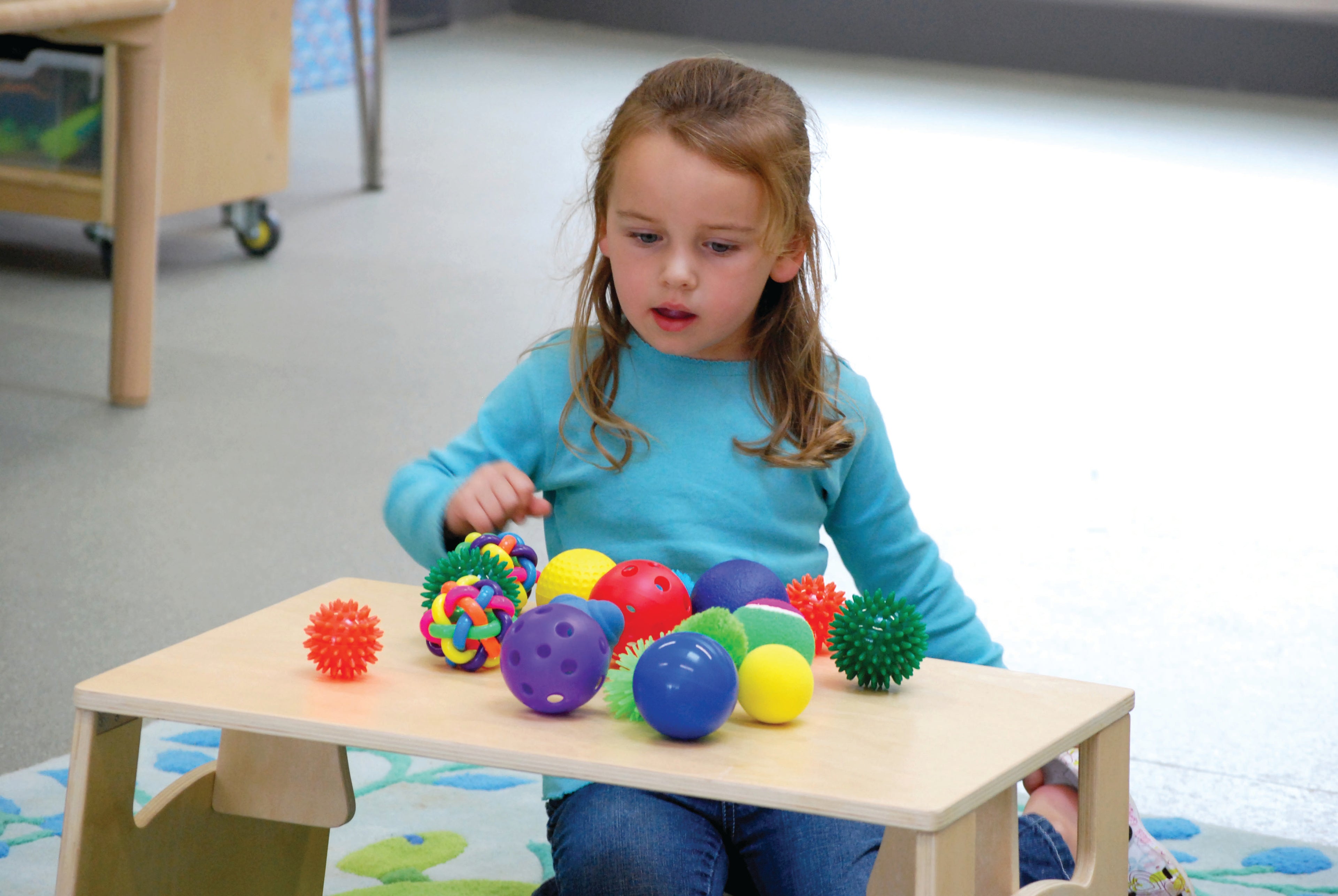 Sensory ball pack with colorful spiky and smooth balls on a table