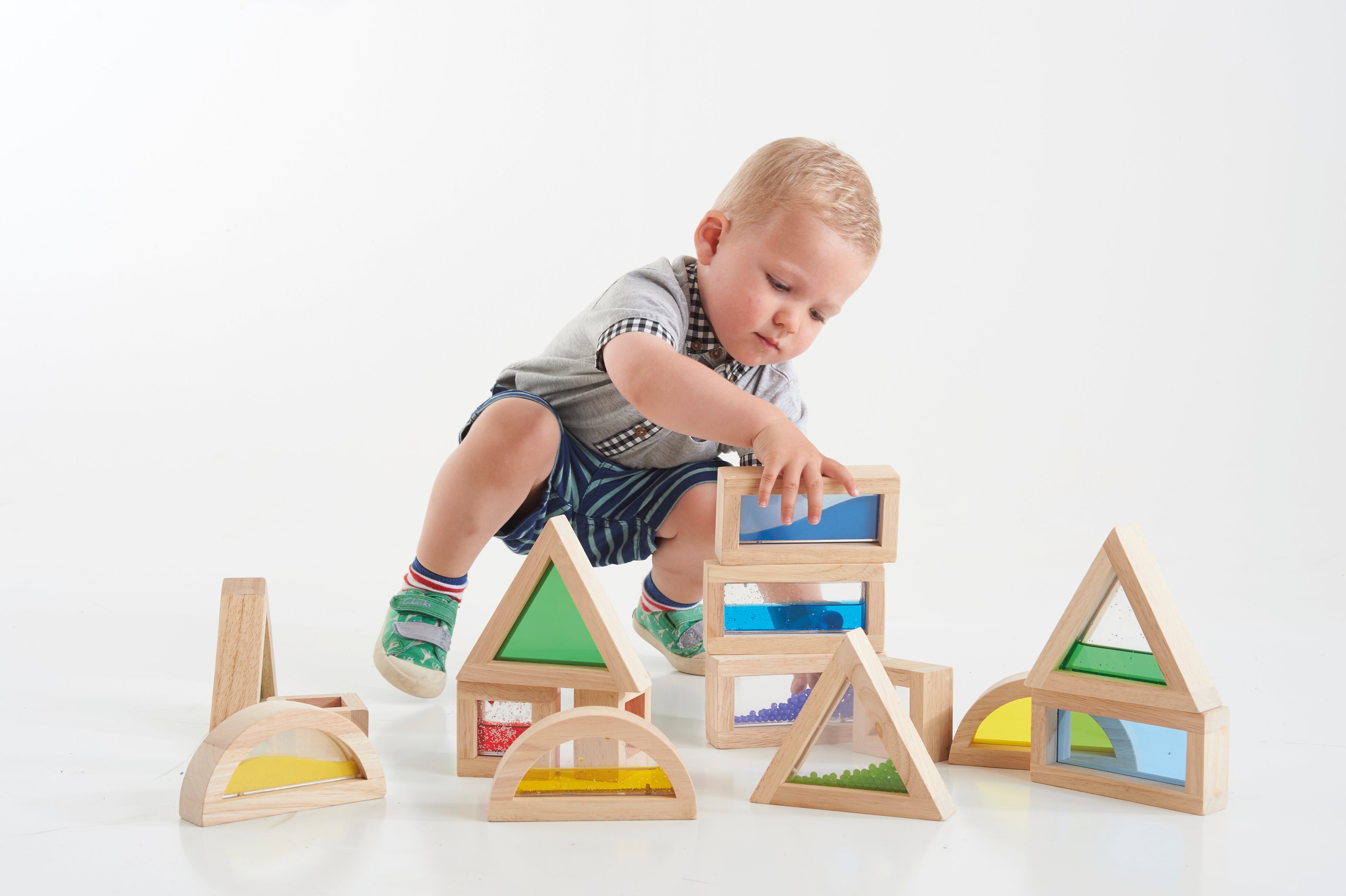 Wooden sensory blocks set with rainbow bead panels and geometric arches