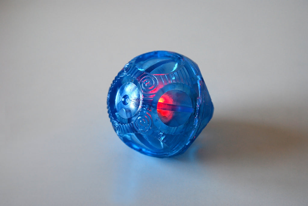 Blue translucent flashing bounce ball with red light window