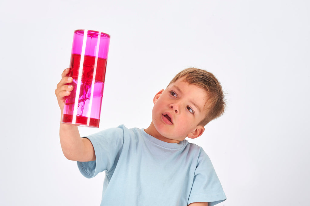 Sensory jumbo ooze tube with bright pink translucent gel, held upright.