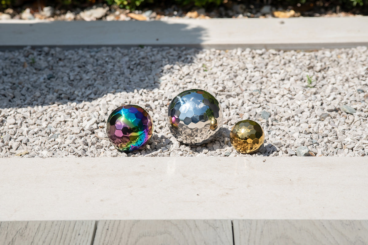Iridescent metallic mosaic balls set of 3: rainbow, silver, and gold on gravel