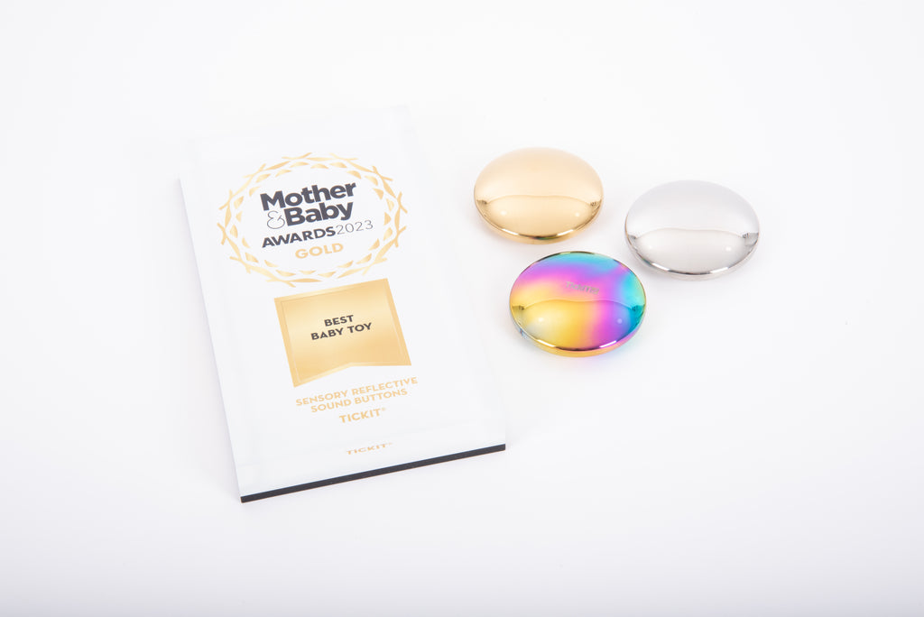 Set of three sensory sound buttons with smooth, iridescent metallic caps