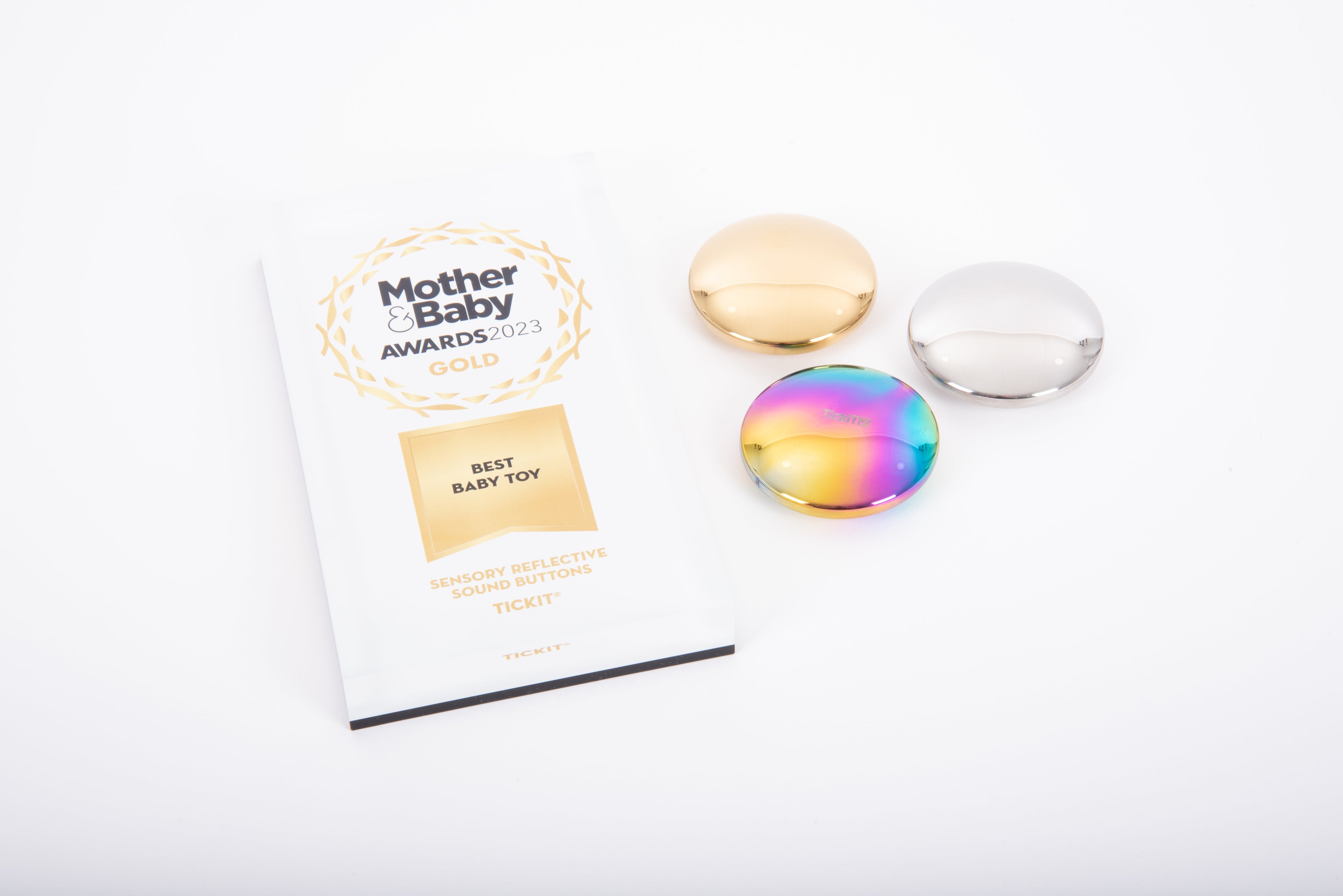 Set of three sensory sound buttons with smooth, iridescent metallic caps