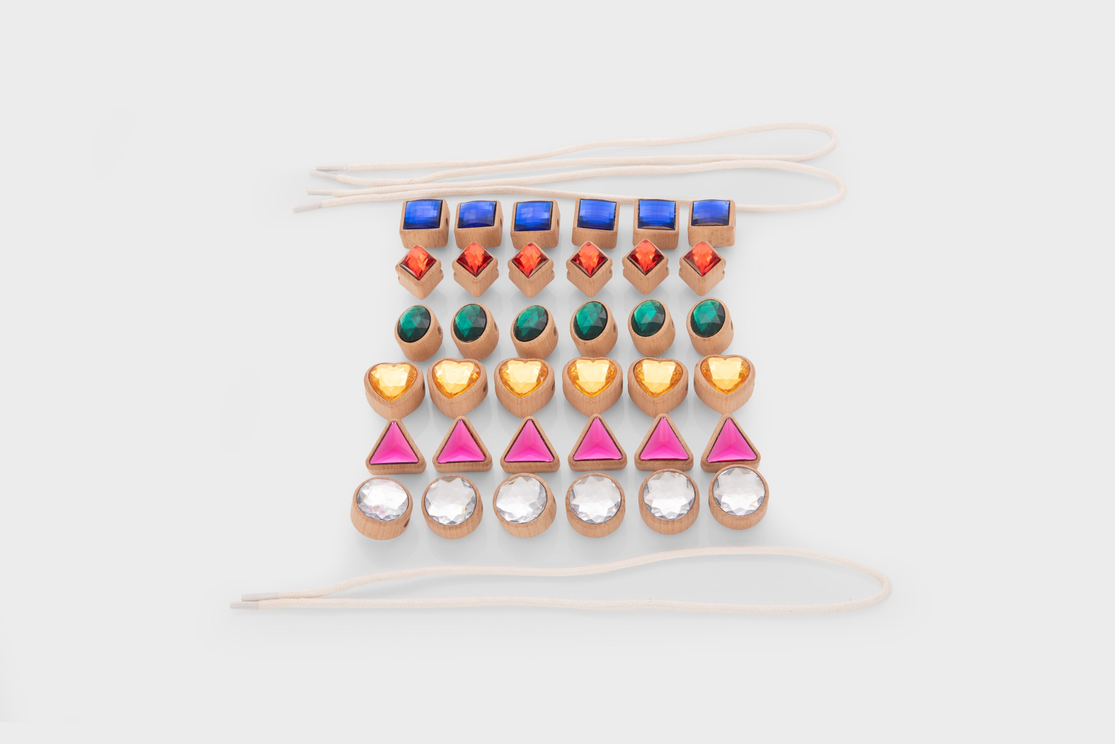 Shape lacing jewels strand: blue squares, pink triangles, gold heart beads and silver discs