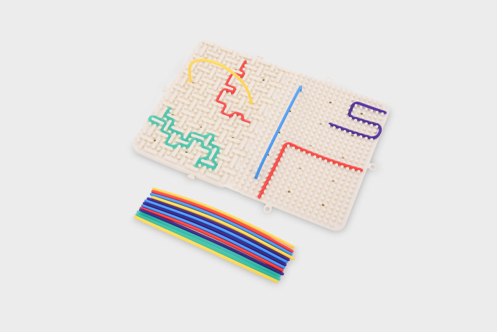 Beige activity maze board with colorful route outlines and rainbow strips