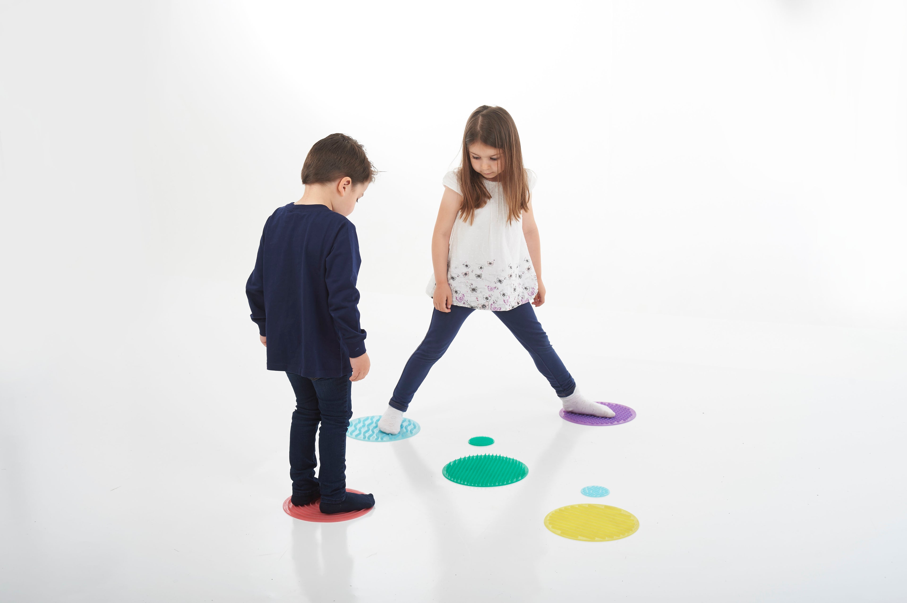 Assorted sensory circles on the ground during a kids play activity