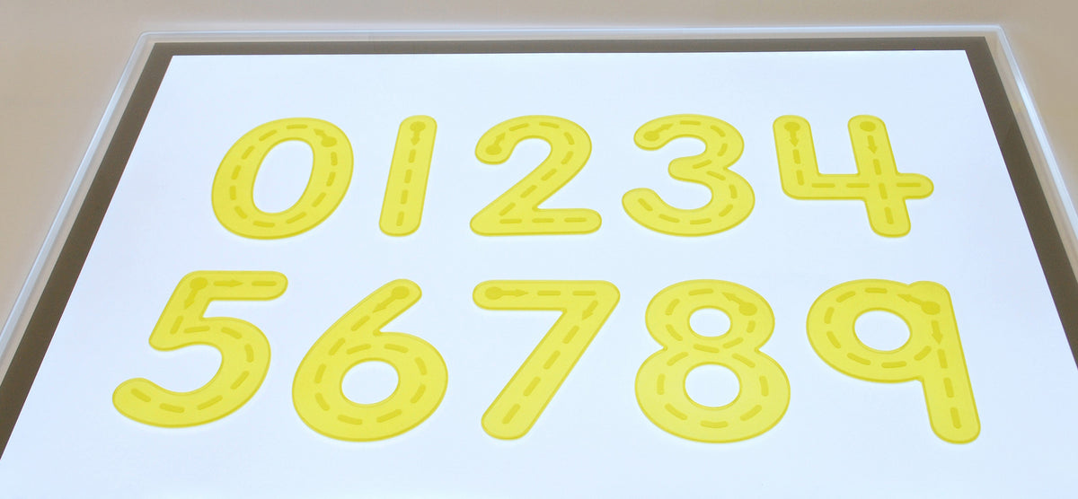 Yellow foam trace numbers on a light board, digits 0–4 visible