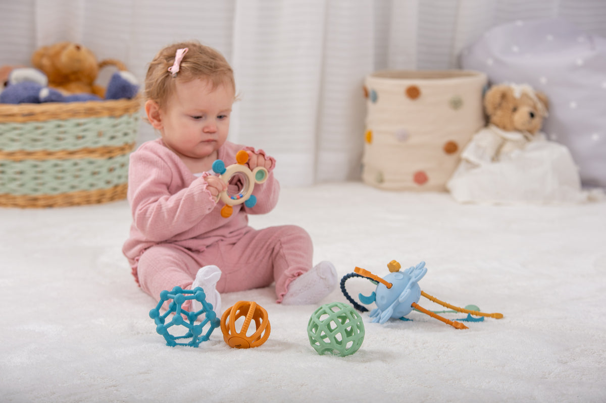 Child playing on a soft mat; yellow trace number pieces not clearly visible