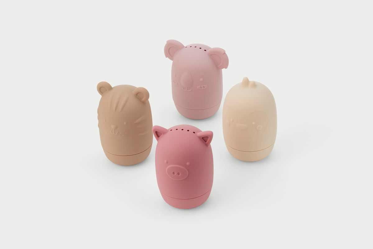 Set of five animal-shaped silicone squirter toys in earth-tone colors.