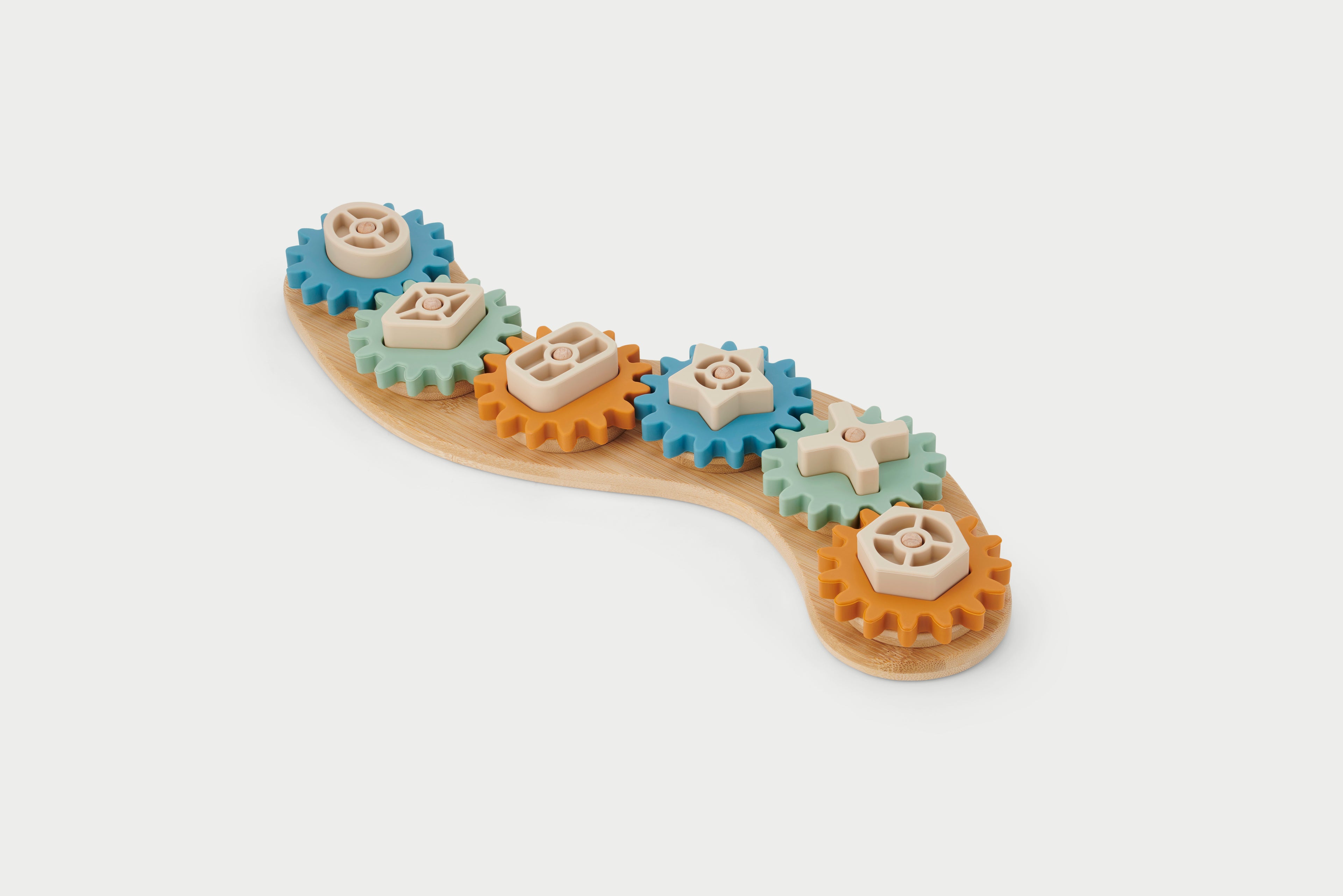 Silisoft Gears puzzle with gear pieces on curved wooden base, blue and tan