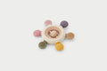 Baby rattle teether with wooden ring and fabric beads, earth-tone colors