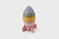 Earth-tone rocket stacker toy with layered cone top and pink base