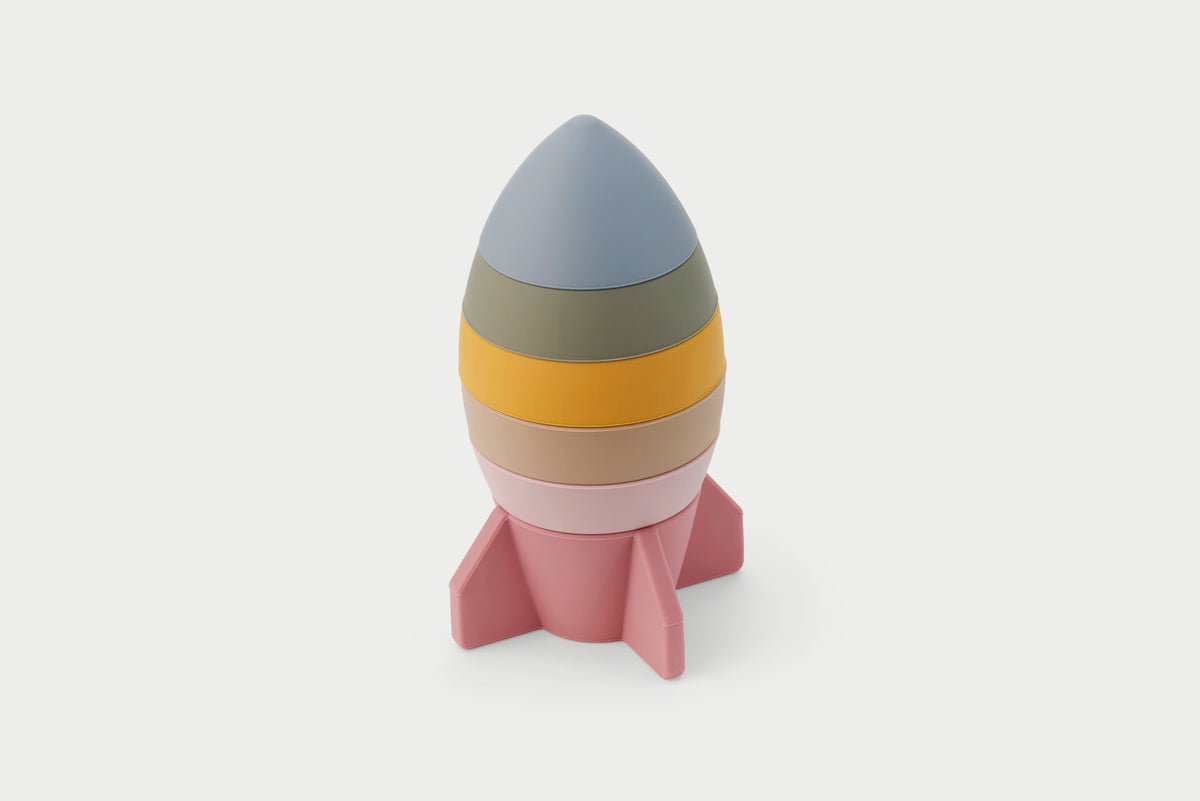 Earth-tone rocket stacker toy with layered cone top and pink base