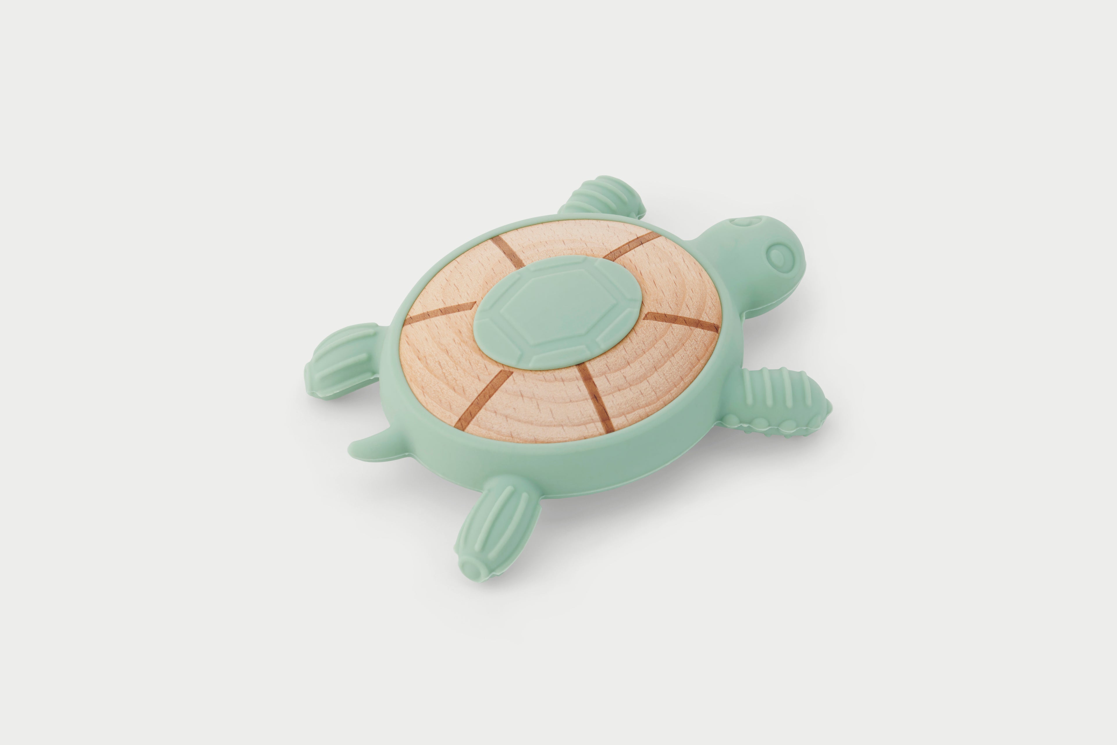 Mint green turtle-shaped silicone teether with wood-look textured shell