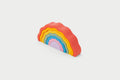 Rainbow wobble stack toy with arched layers in orange to purple