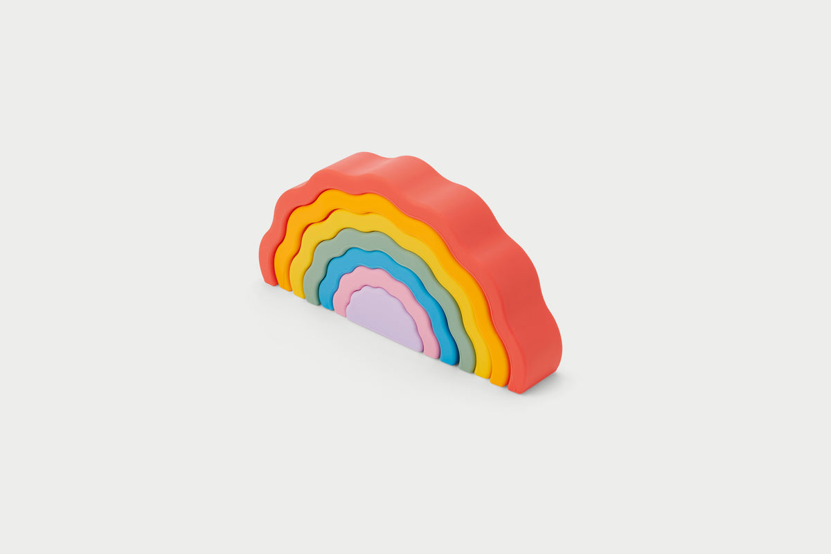 Rainbow wobble stack toy with arched layers in orange to purple