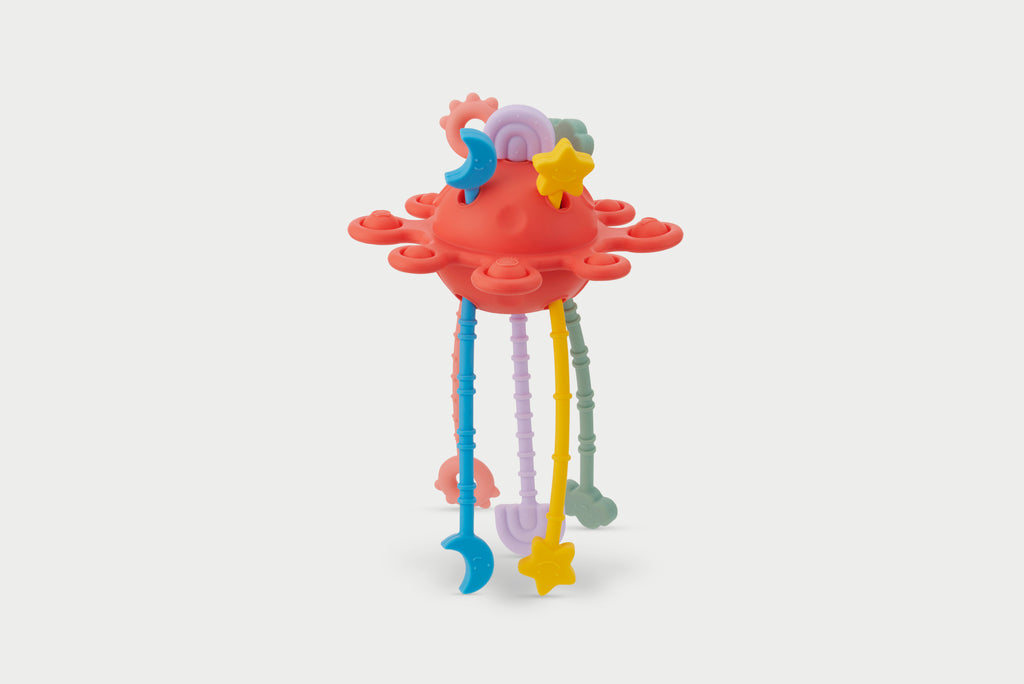 Silisoft zip pull rainbow toy with red top and colorful zipper tentacles