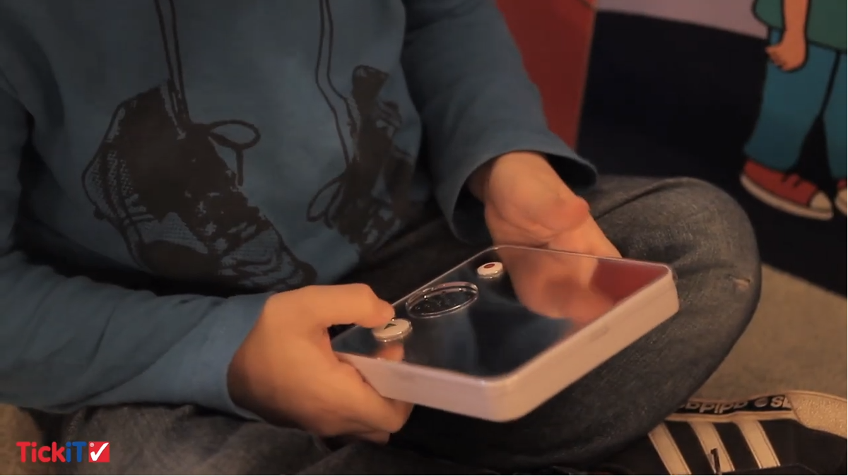 White handheld sound-and-mirror learning device with speaker grille and buttons